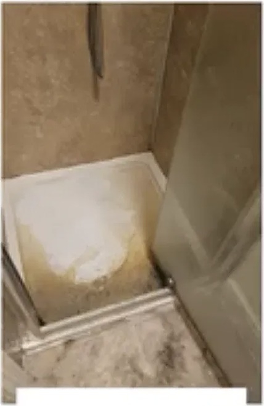 Shower cabin with limescale and soap build-up before deep cleaning in Norwich